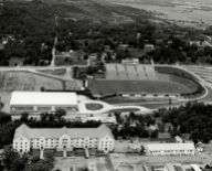 This 1955 photo shows a recently completed Barnhill Fieldhouse adjacent to the south endzone of Razorback Stadium. Funding for the new facility came primarily at the behest of Gov. Francis Cherry, who was described in the 1954 Razorback as a "frequent visitor" to the Hill who "rarely misses a Razorback football game which is in or near Arkansas."