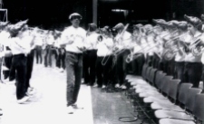 Jim Robken was the seminal off-court contribution to Arkansas basketball. Installed as band director in 1978, Robken, pictured above, turned Barnhill into his musical playground. As "The University of Arkansas Razorback Band: A History, 1874-2004" noted, "he renamed the (Pep Band) the 'Hogwild Band' and became a legend stirring up the fans in the fieldhouse to the strains of 'The William Tell Overture' and galloping around the building wearing a Lone Ranger mask."