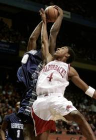 Arkansas returned to the NCAA Tournament in 2001, but fell to Georgetown in the first round. The game ended on a controversial call from officials, who ruled the Hoyas beat the buzzer on a last-second layup. The disappointment in the postseason precipitated a frustrating campaign in 2002 that culminated in the firing of head coach Nolan Richardson.